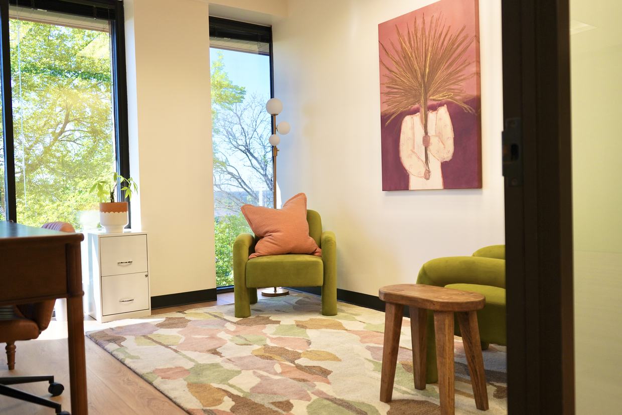 A therapy room overlooking the trees in Northwest Austin